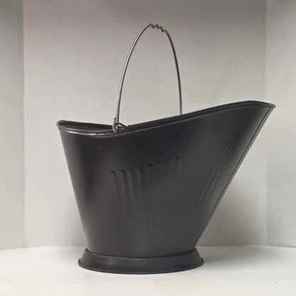 Vintage metal coal scuttle with bail handle for fireplace and wood stove use.
