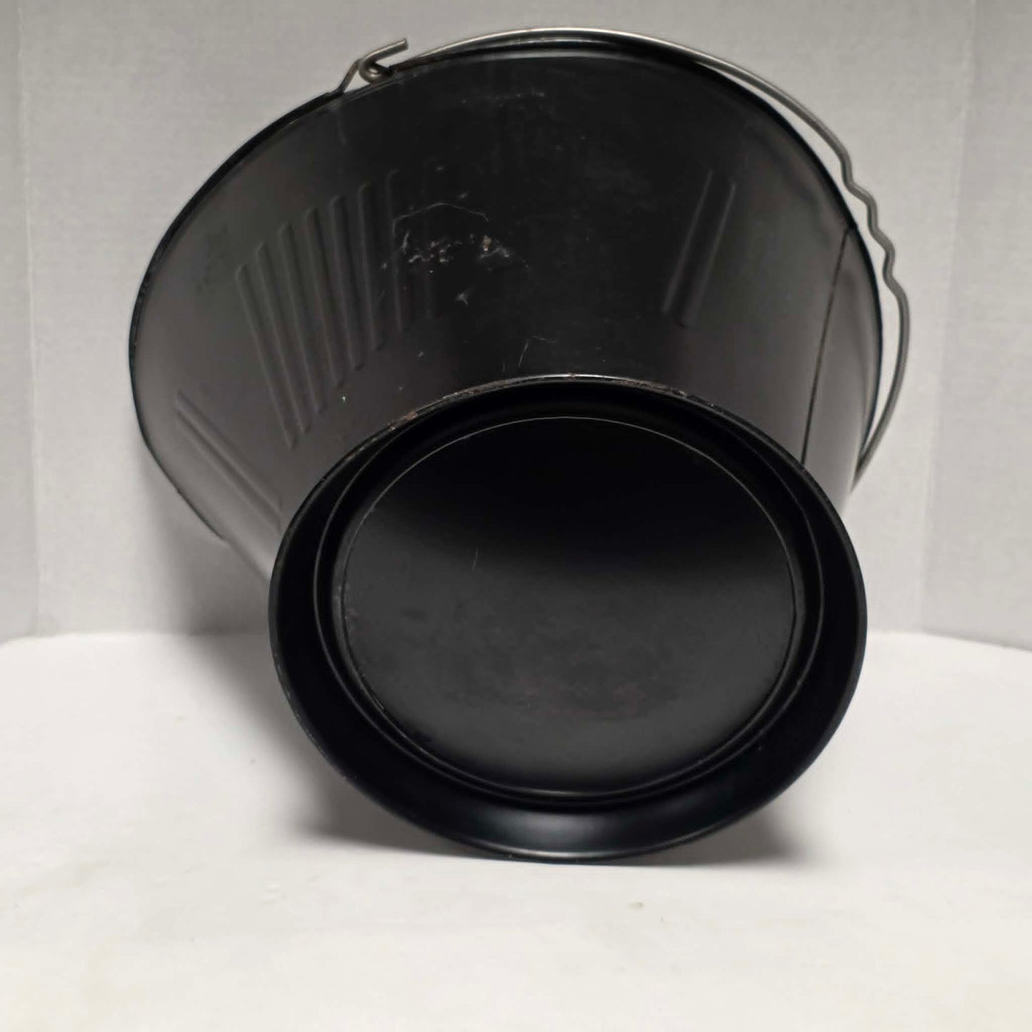 Vintage metal coal scuttle with bail handle for fireplace and wood stove use.
