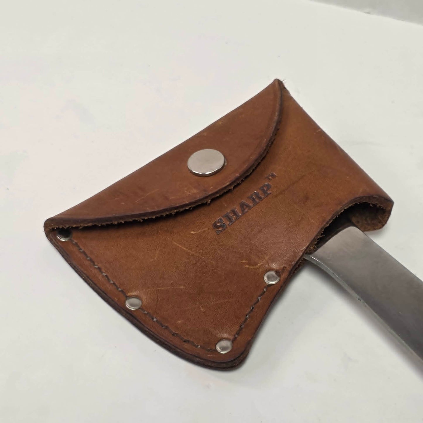 A beautifully crafted vintage camping axe featuring a rosewood handle, sharp stainless steel blade, and quality leather sheath.

