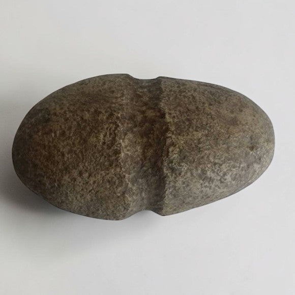 Native American stone axe hammerhead artifact with primitive craftsmanship and historical collectible appeal.