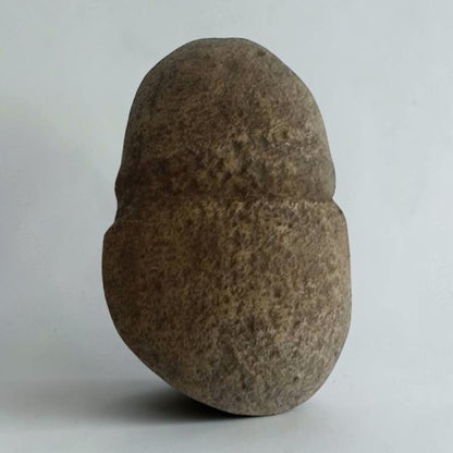 Native American stone axe hammerhead artifact with primitive craftsmanship and historical collectible appeal.