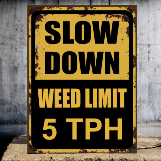 Vintage-style sign with 'Slow Down Weed Limit 5 TPH' text on a textured wall background
