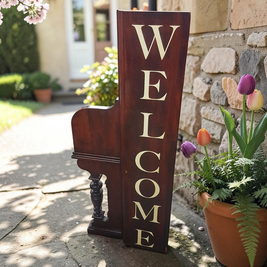 Unique welcome sign created from an authentic century-old piano, perfect for music lovers and rustic spaces.