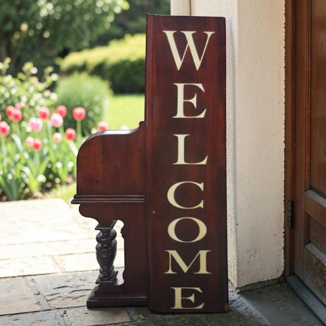 Unique welcome sign created from an authentic century-old piano, perfect for music lovers and rustic spaces.