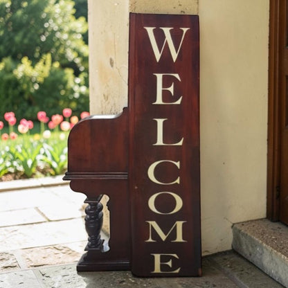 Unique welcome sign created from an authentic century-old piano, perfect for music lovers and rustic spaces.