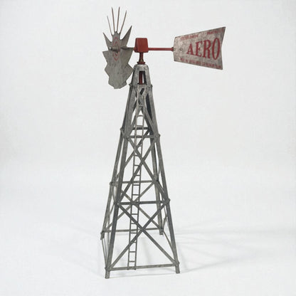 Model windmill with 'Aero' sign on a white background