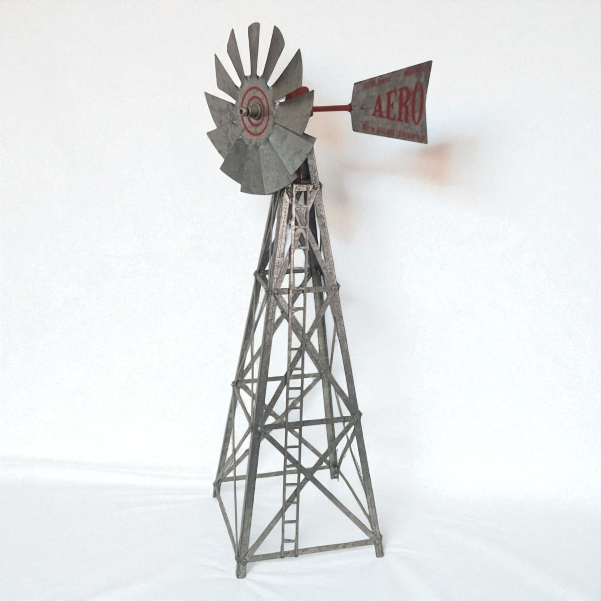 Metal windmill model on a white background