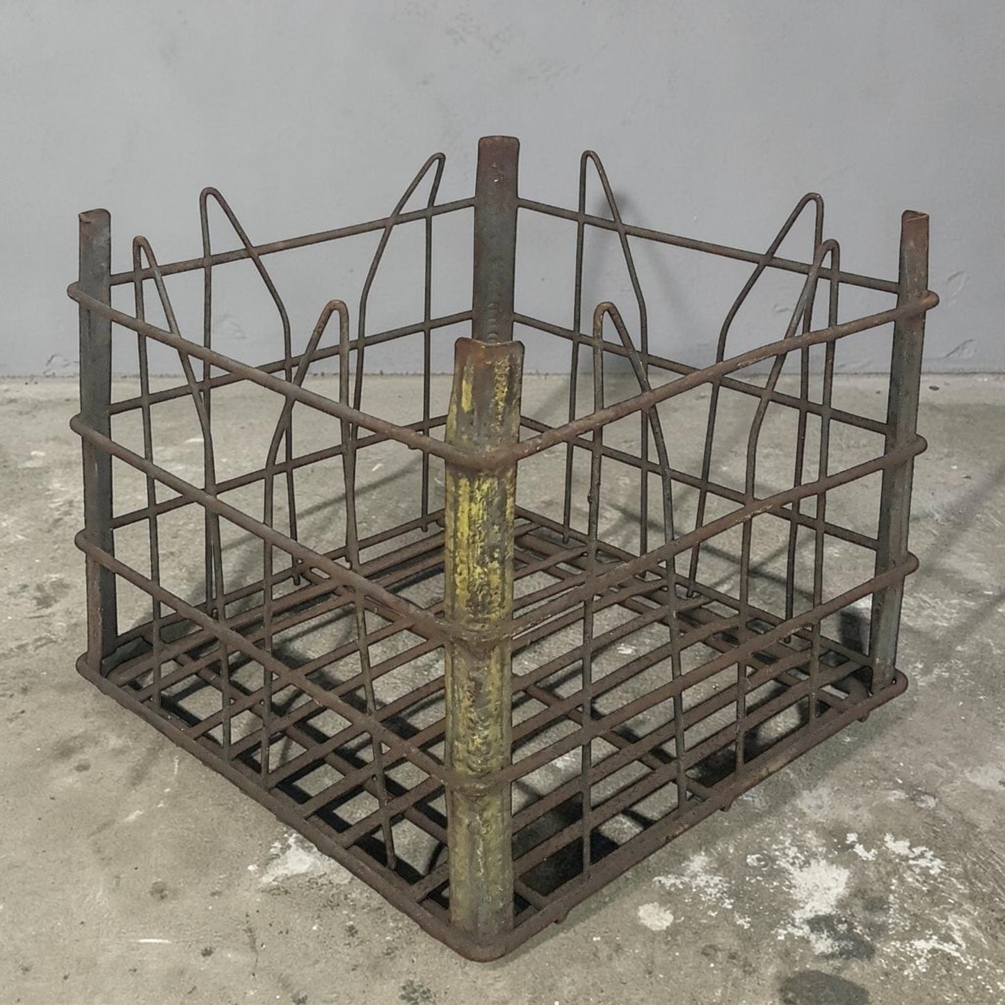 antique wire milk crate with beautiful primitive industrial character and aged patina.