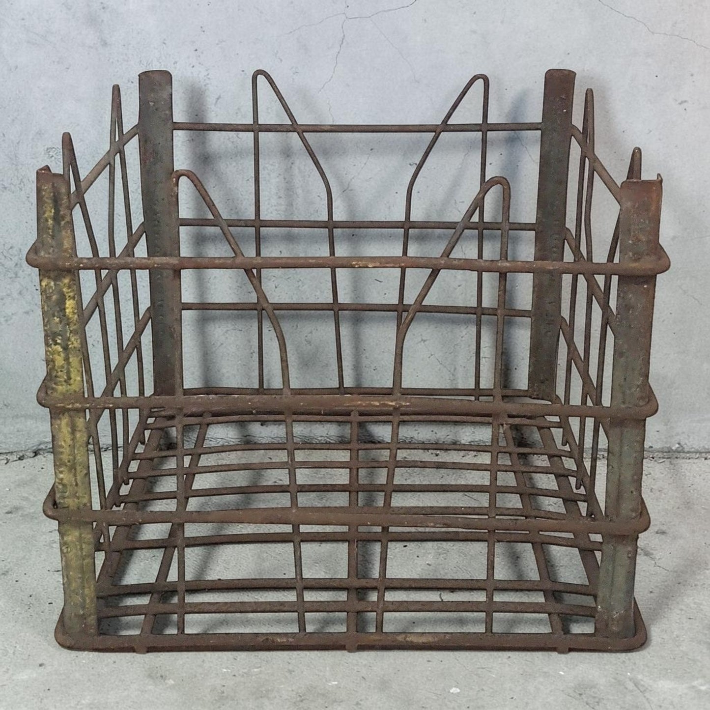 antique wire milk crate with beautiful primitive industrial character and aged patina.
