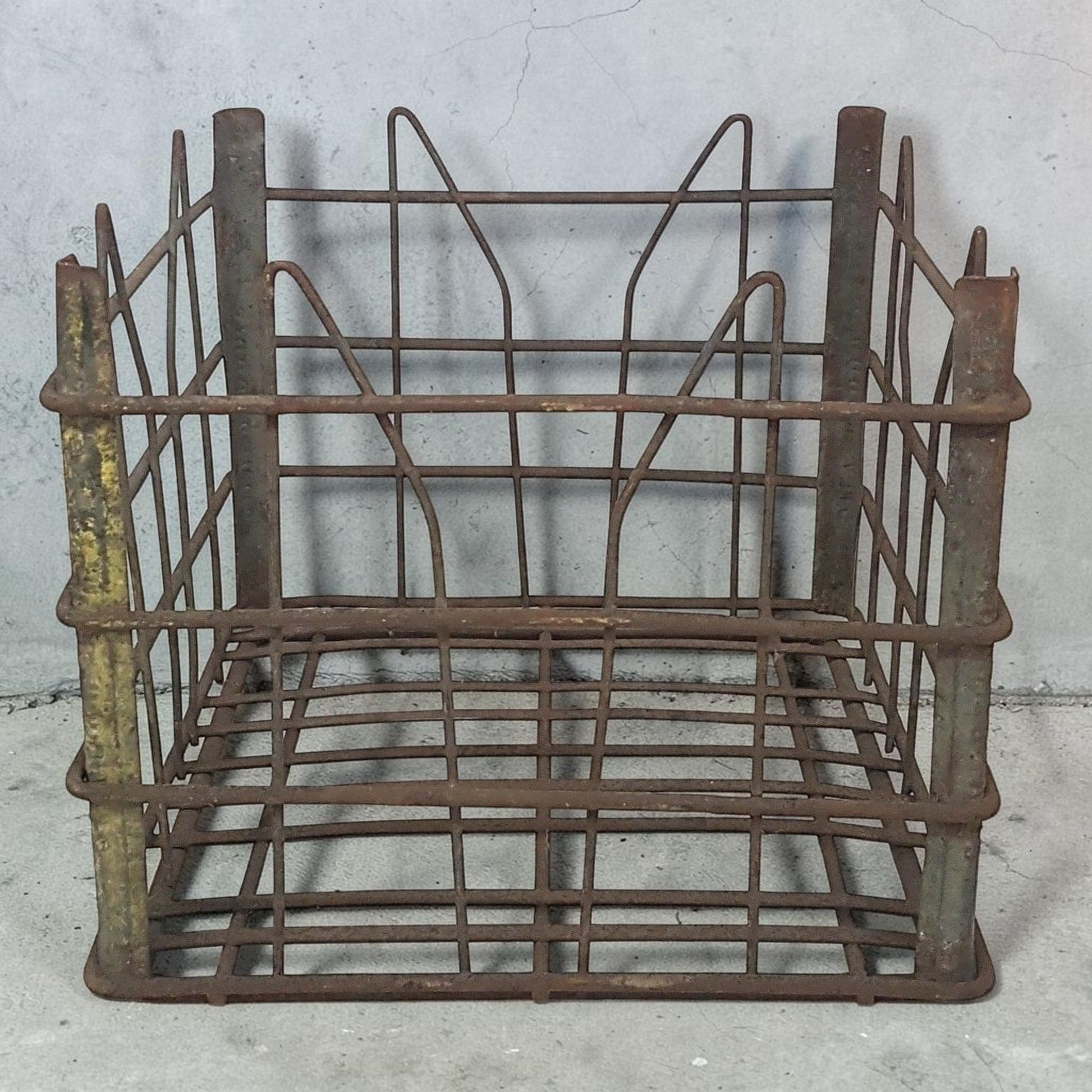 antique wire milk crate with beautiful primitive industrial character and aged patina.