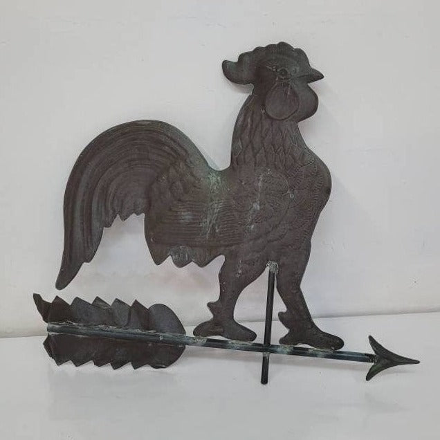 Antique hollow-bodied copper rooster weathervane with directional base, architectural salvage for farmhouse or barn decor.