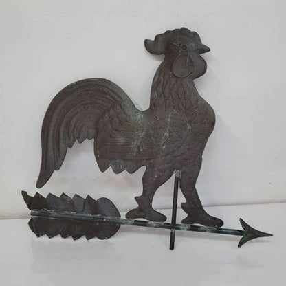 Antique hollow-bodied copper rooster weathervane with directional base, architectural salvage for farmhouse or barn decor.