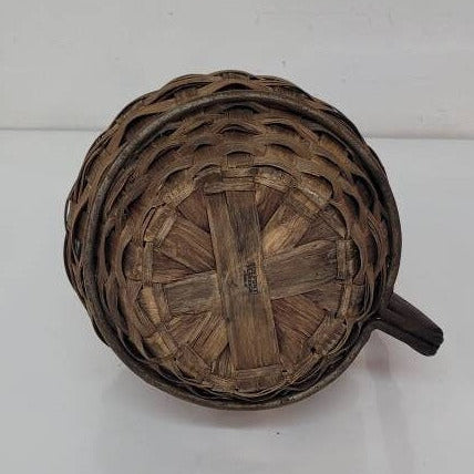 green glass wine bottle with wicker basket oudepont italy