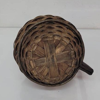 green glass wine bottle with wicker basket oudepont italy