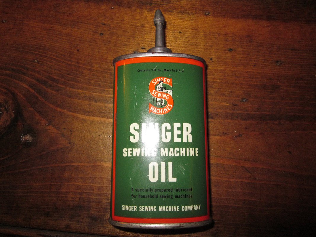 vintage singer sewing machine oil tin with lead top 3 oz.