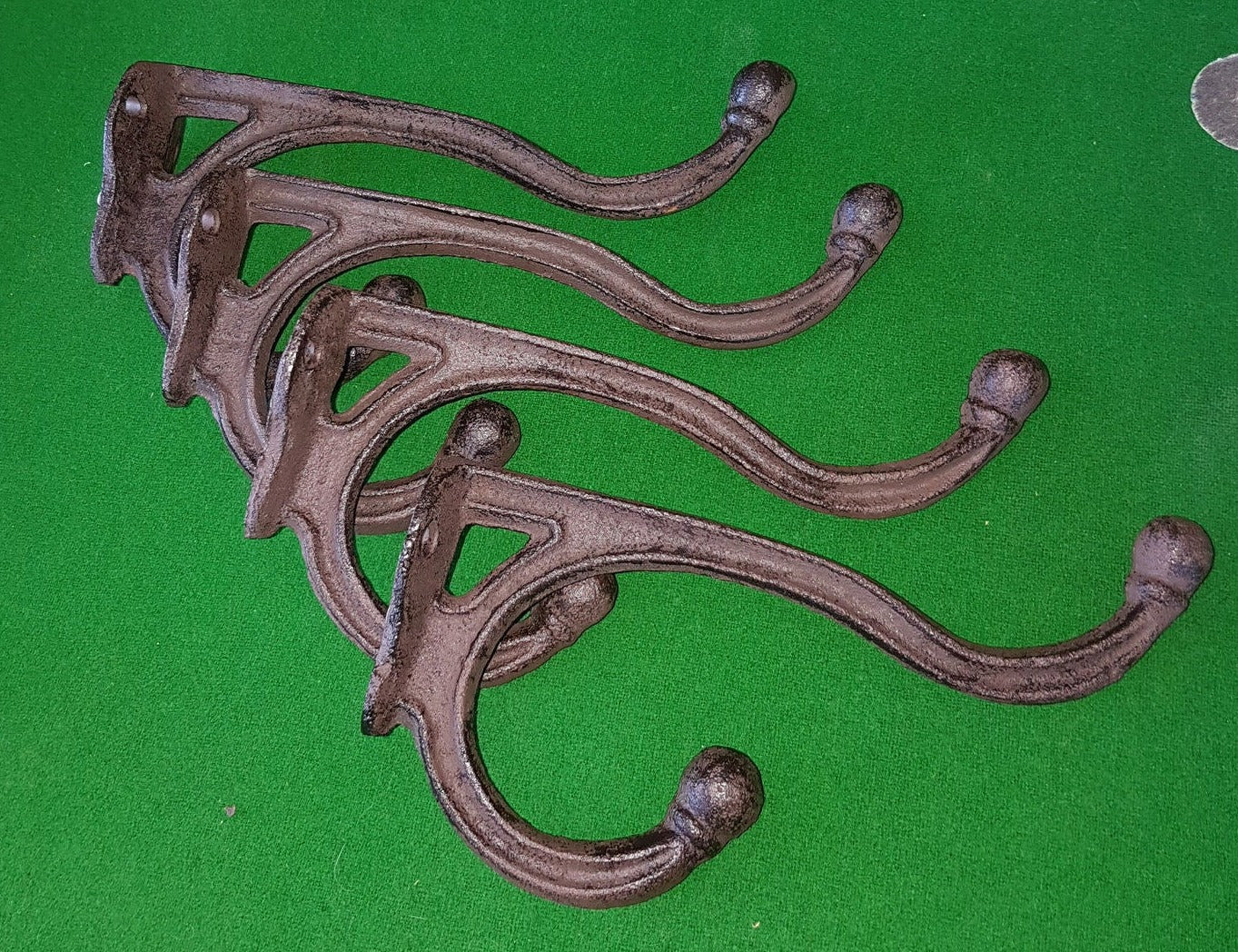 4 large cast iron hooks