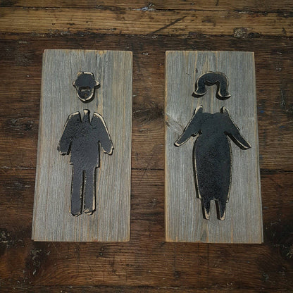bathroom sign wooden man and woman figures
