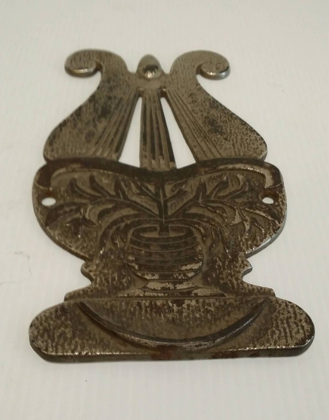 pair of cast iron harp plaques