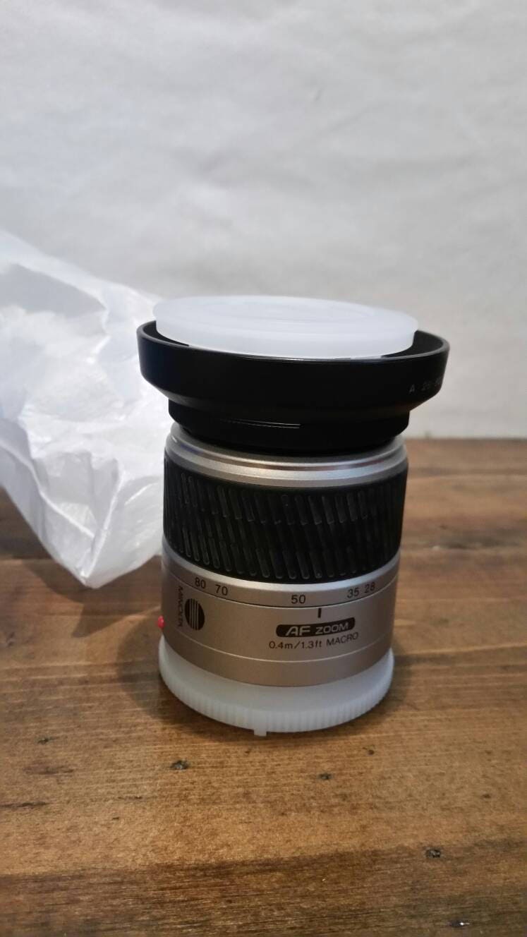 minolta maxxum camera lens still in original packaging