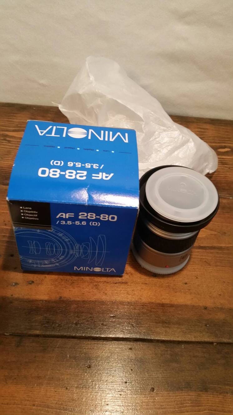 minolta maxxum camera lens still in original packaging