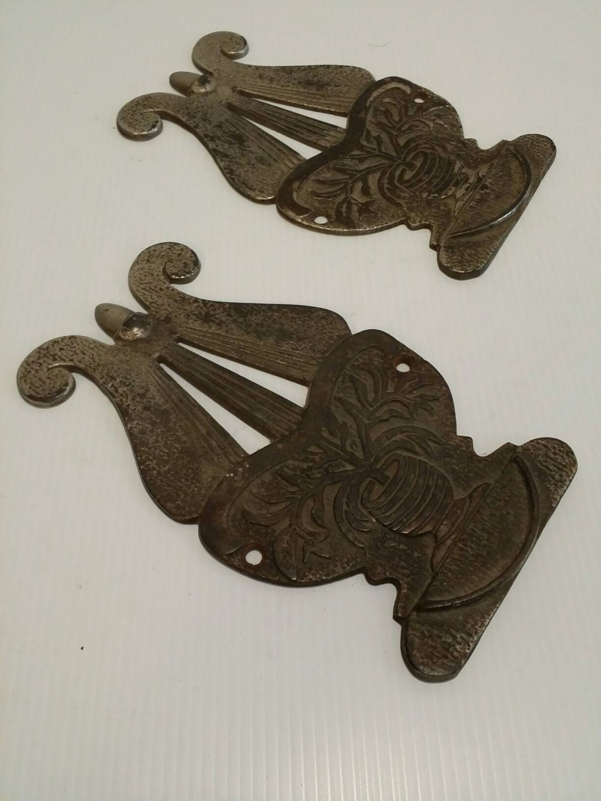 pair of cast iron harp plaques