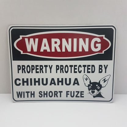 warning patrolled by guard dogs metal sign