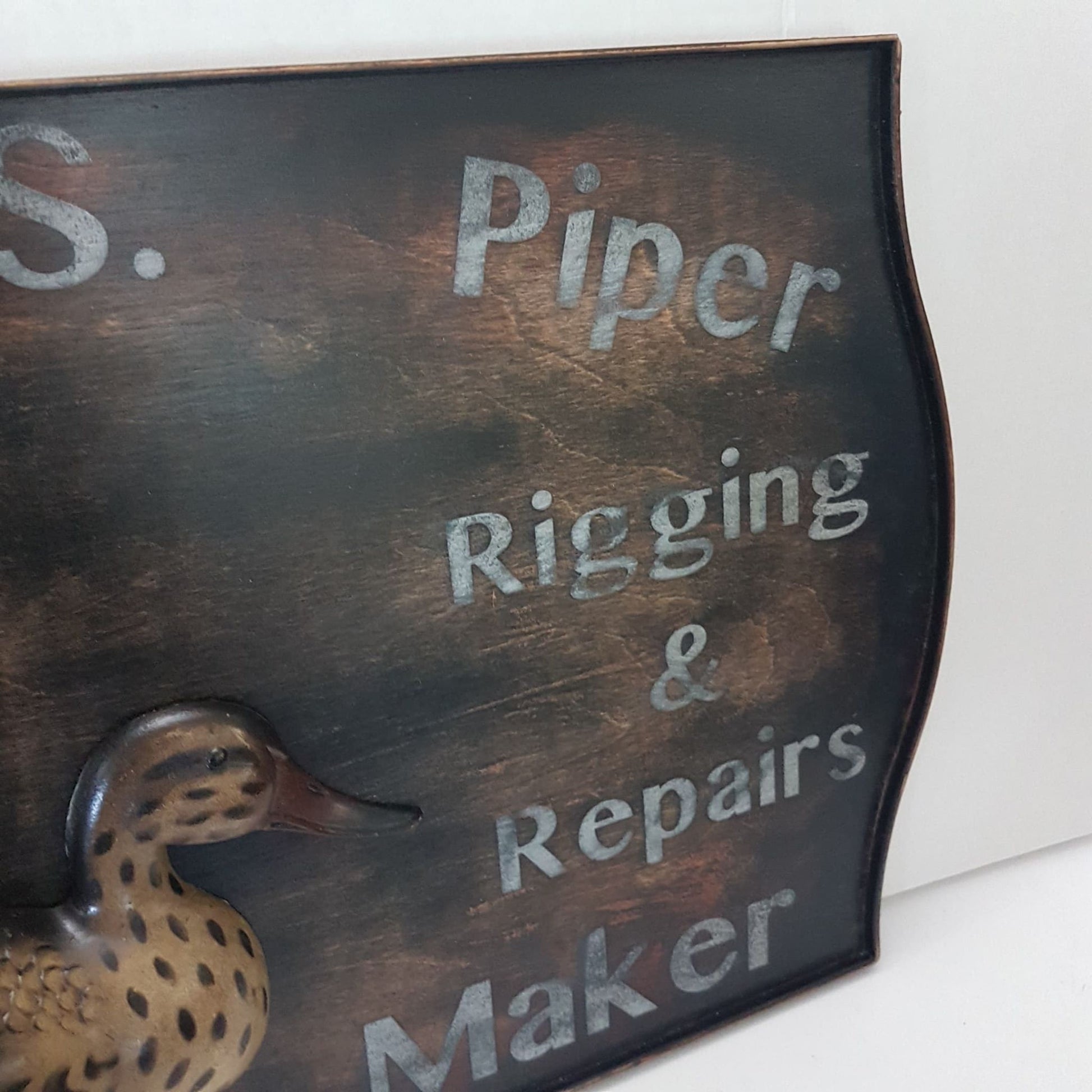 wooden framed decoy maker sign