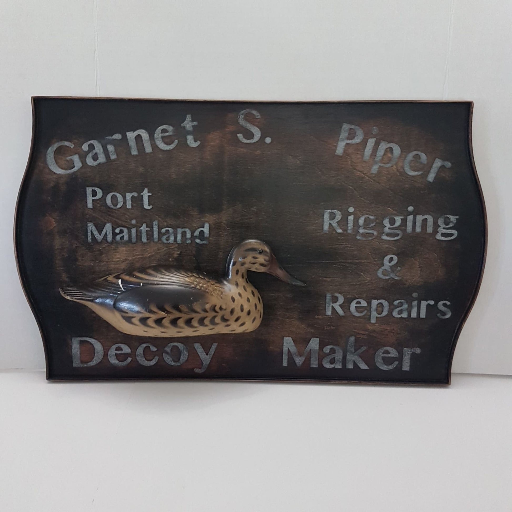 wooden framed decoy maker sign