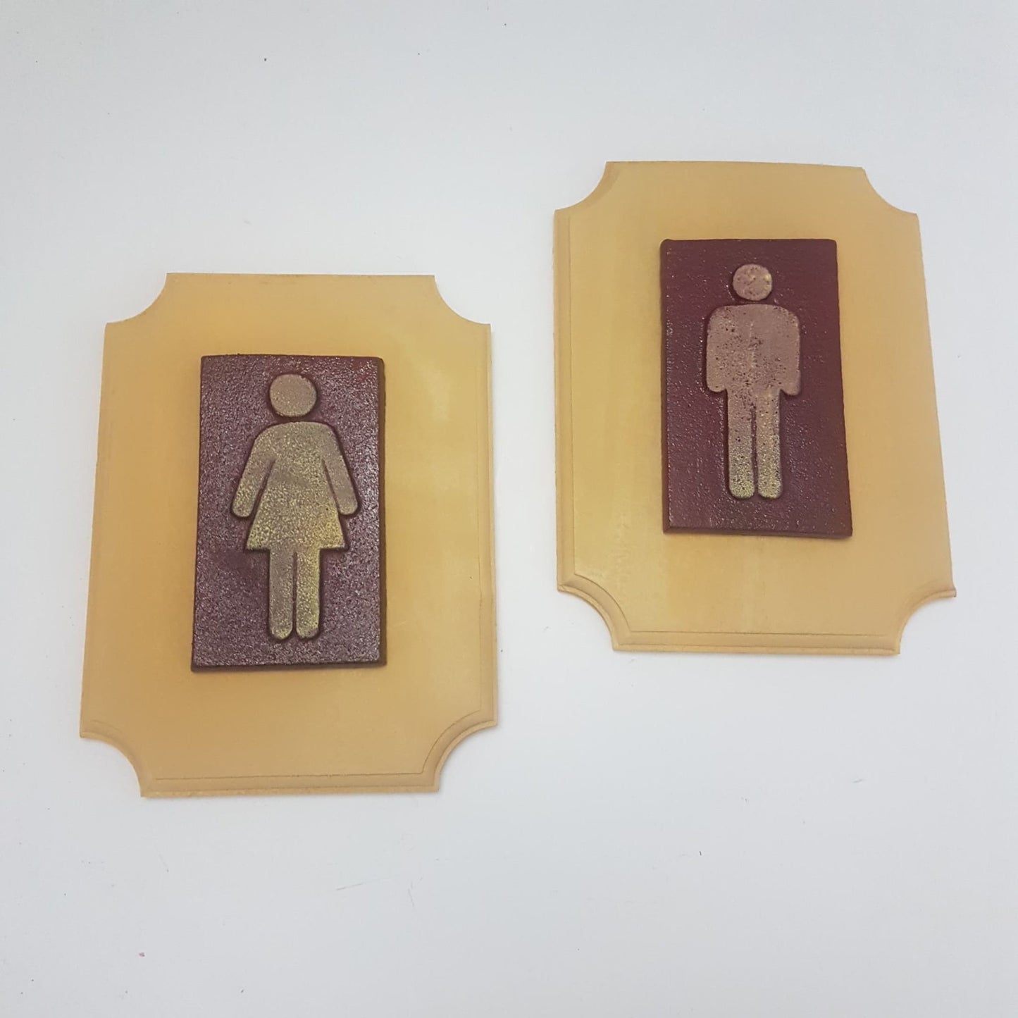 bathroom signs  cast iron and wood