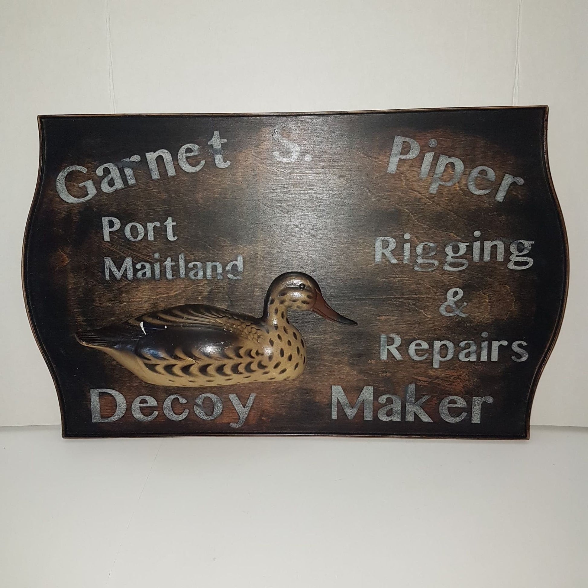 wooden framed decoy maker sign