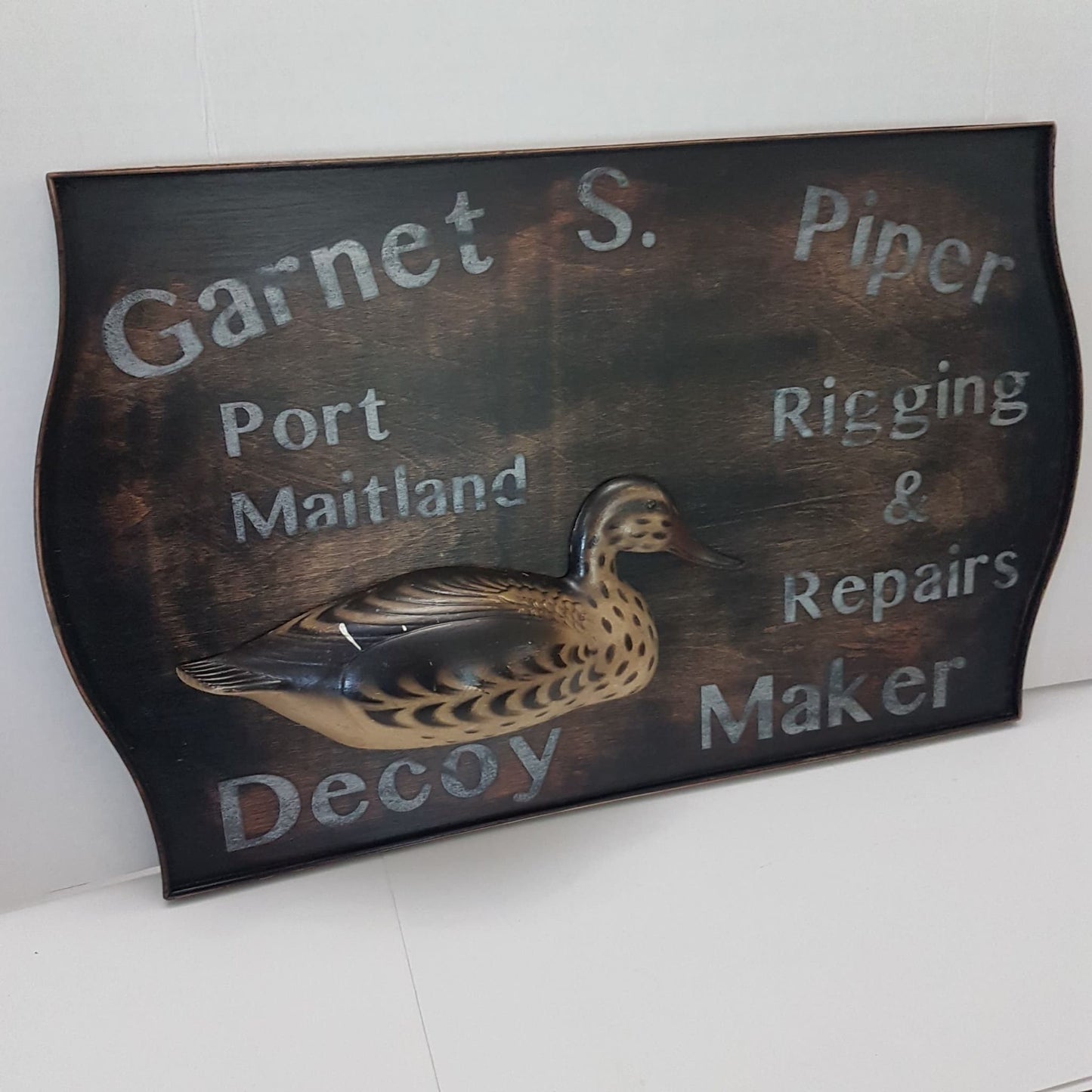 wooden framed decoy maker sign