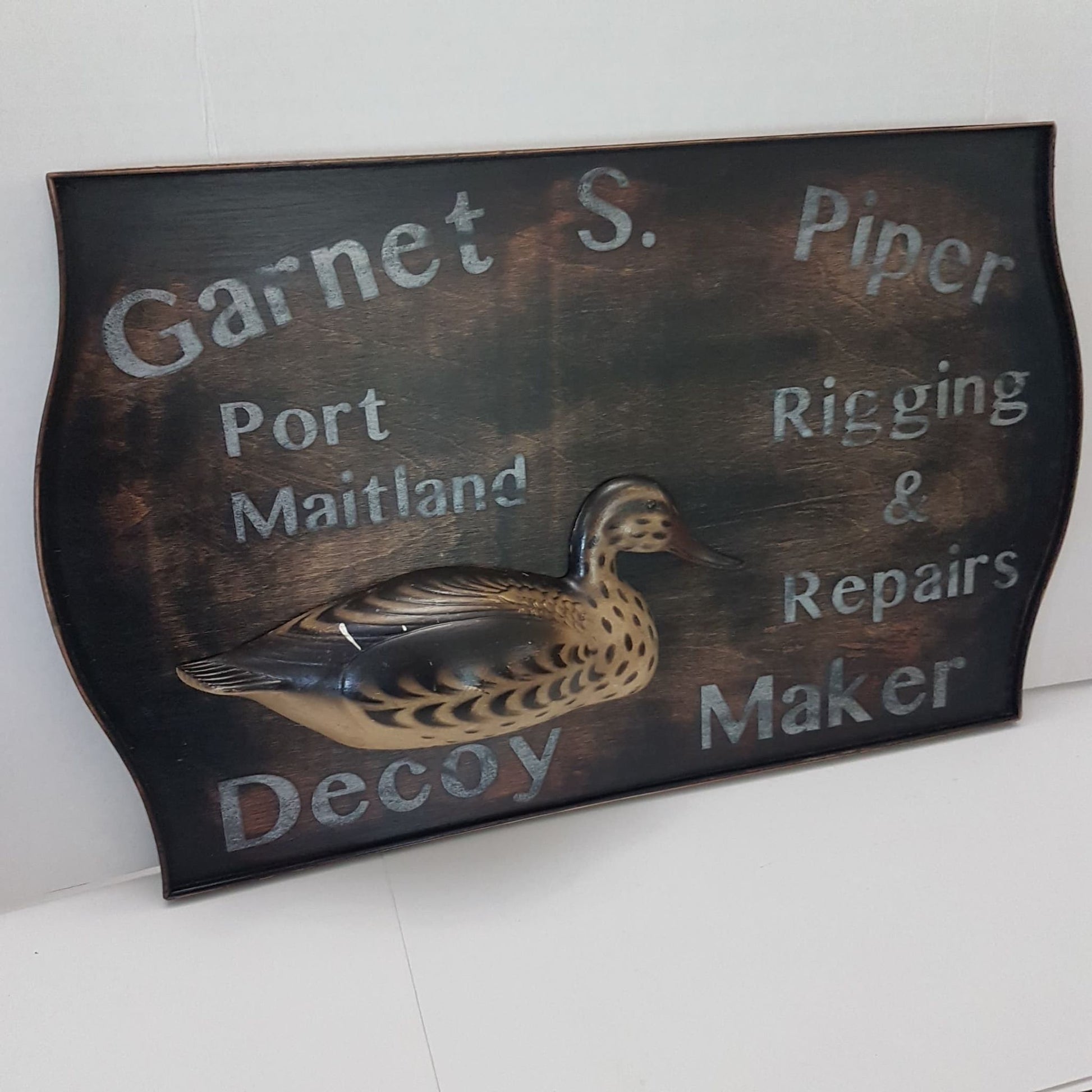 wooden framed decoy maker sign