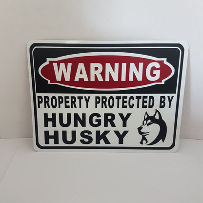 beware of dog sign  warning property protected by hungry husky