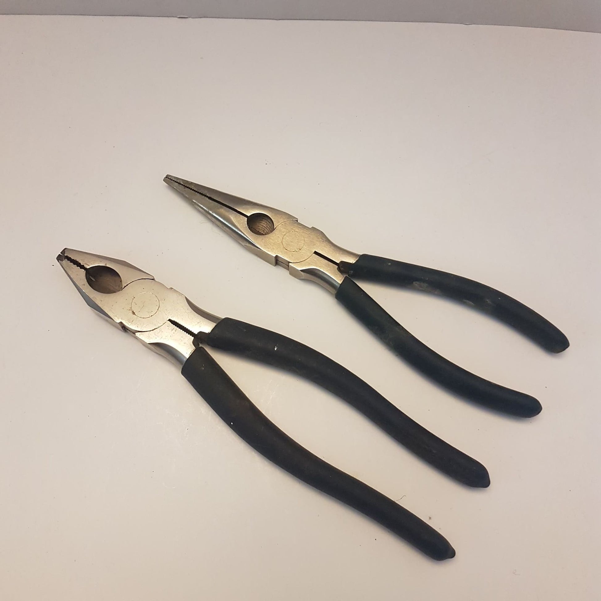 2 pairs of mastercraft pliers