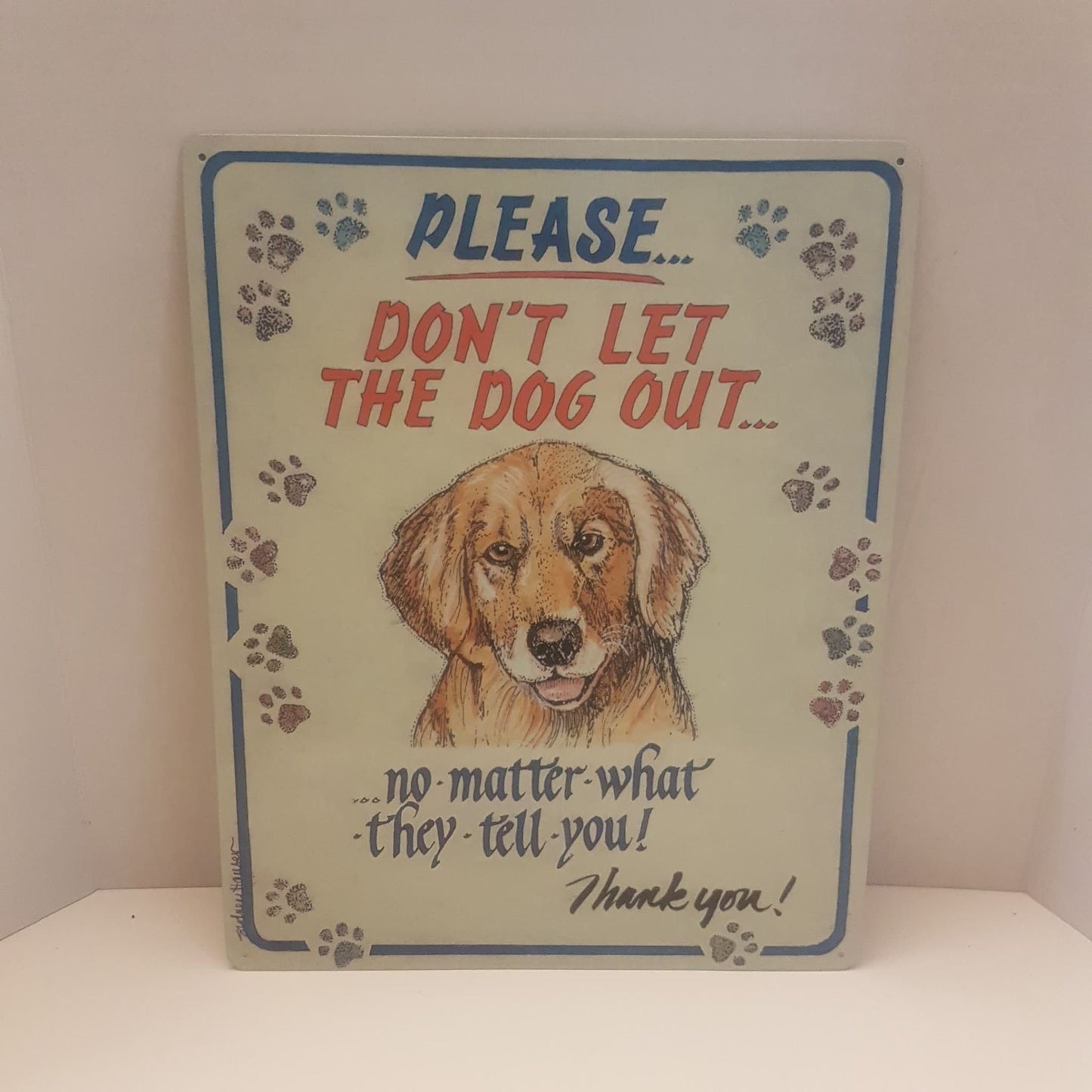 really cute tin dog sign