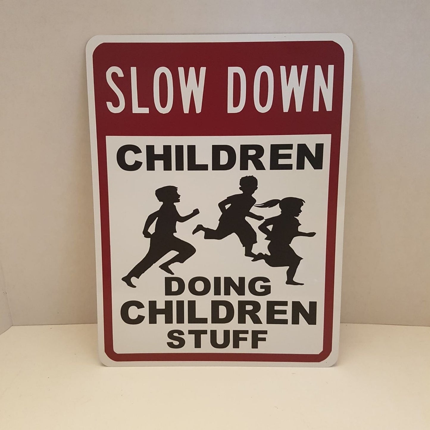 slow down children doing children stuff playground  / yard sign