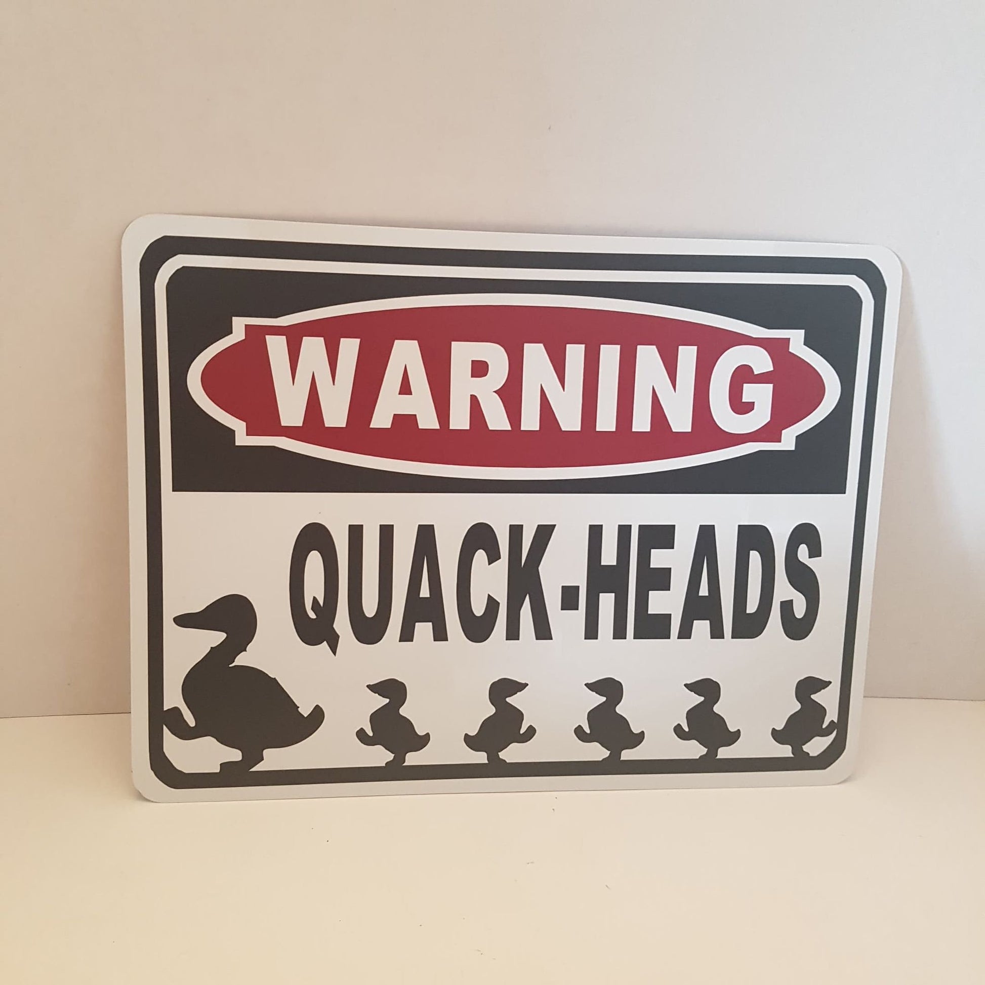 warning quackheads duck sign farm sign