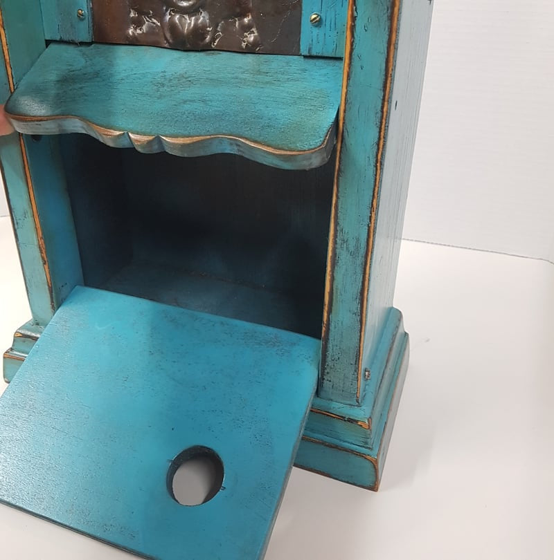 rustic birdhouse hand built from an antique steeple clock case