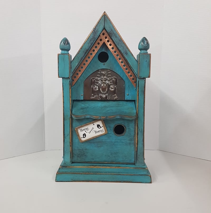 rustic birdhouse hand built from an antique steeple clock case