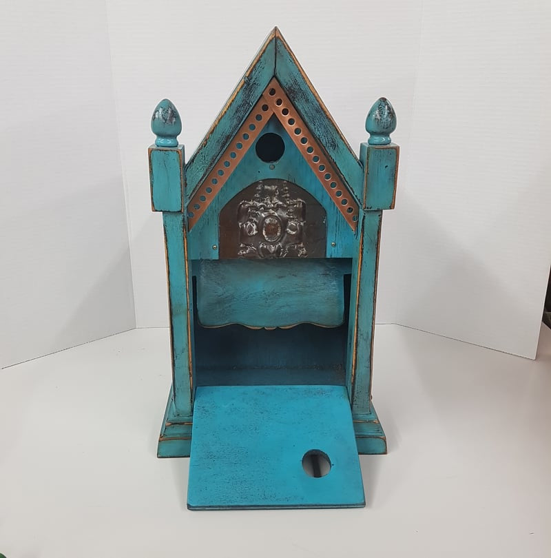 rustic birdhouse hand built from an antique steeple clock case