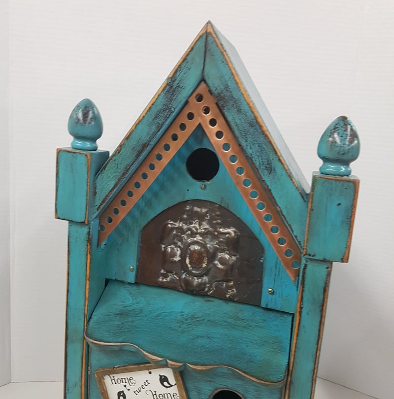 rustic birdhouse hand built from an antique steeple clock case