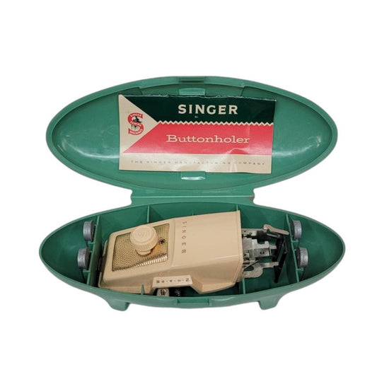 singer sewing buttonholer machine with attachments in box