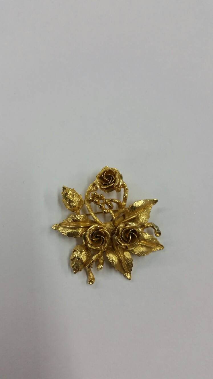 gold rose brooch