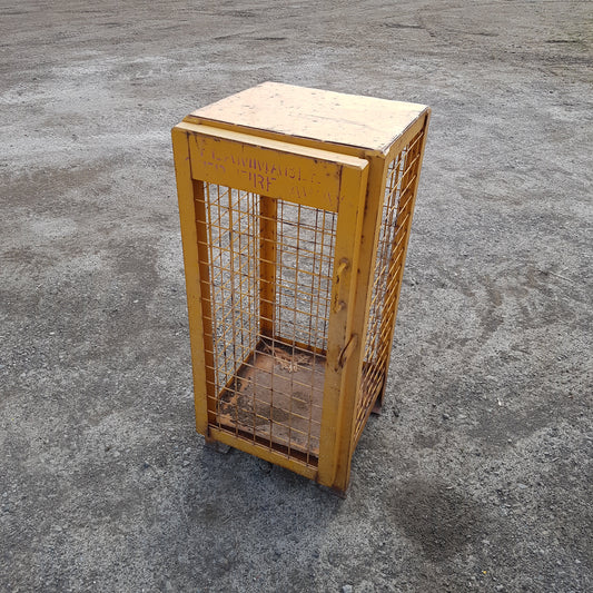 Versatile industrial metal wire cage – perfect as end table or lamp stand.