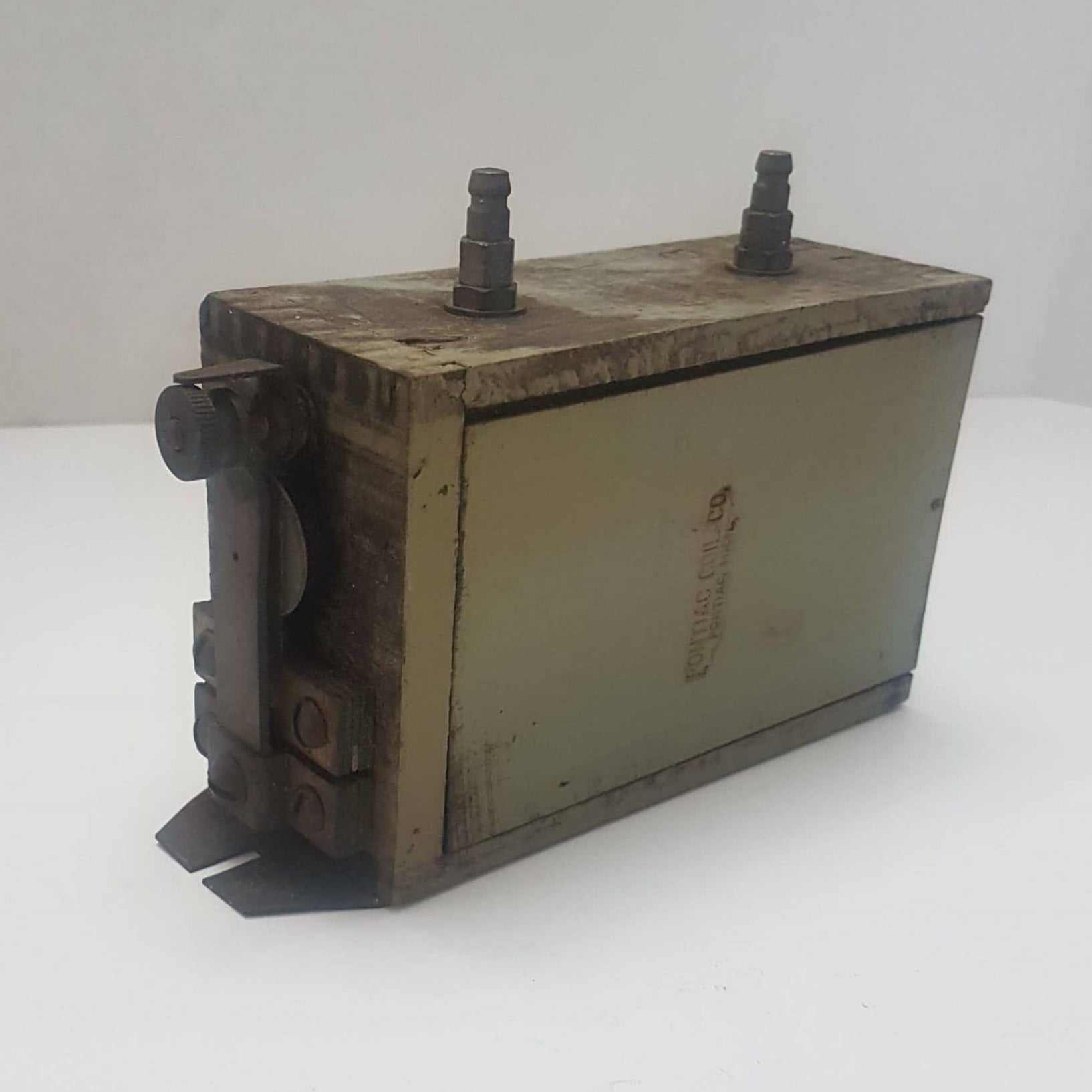 Antique Pontiac wooden T coil with embossed Pontiac Coil Co., Michigan.
